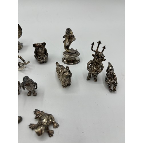 7 - A collection of sterling silver miniature items. Mostly cast animals with with  a Lincoln imp , rock... 