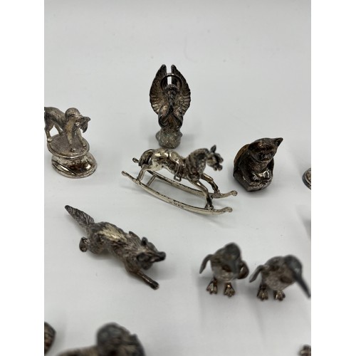 7 - A collection of sterling silver miniature items. Mostly cast animals with with  a Lincoln imp , rock... 