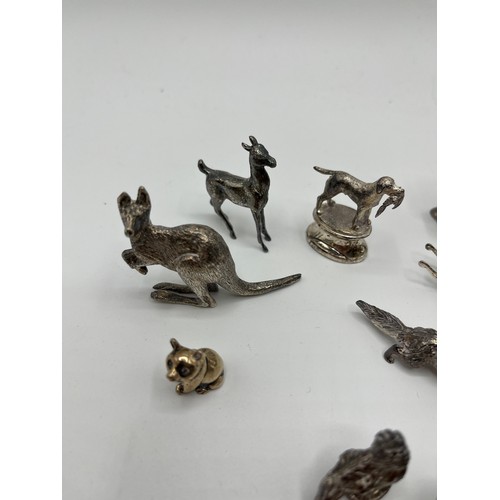 7 - A collection of sterling silver miniature items. Mostly cast animals with with  a Lincoln imp , rock... 