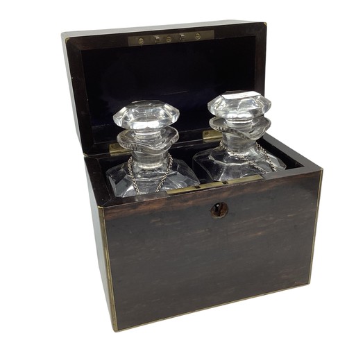 18 - A coromandel cased two bottle decanter set with sterling silver labels together with a boxed writing... 