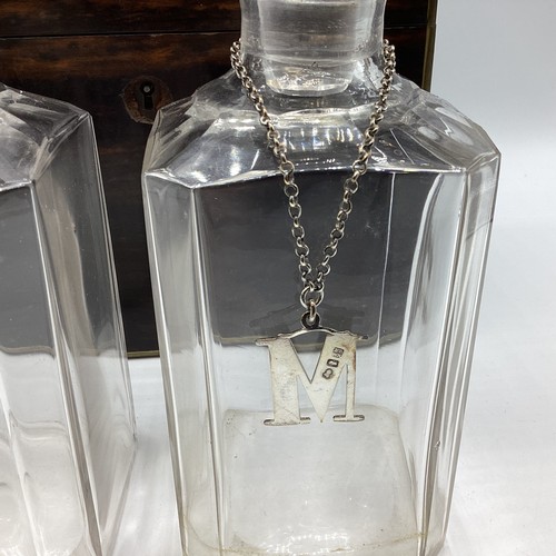 18 - A coromandel cased two bottle decanter set with sterling silver labels together with a boxed writing... 