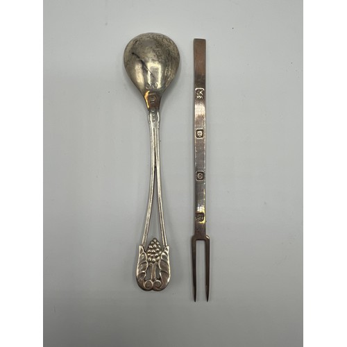 94 - A Georg Jensen 925s silver spoon together with a sterling silver pickle fork. 73g.