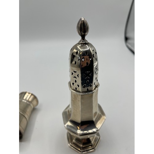 83 - A collection of sterling silver items , a mustard and pepper grinder by Goldsmiths silversmiths Comp... 