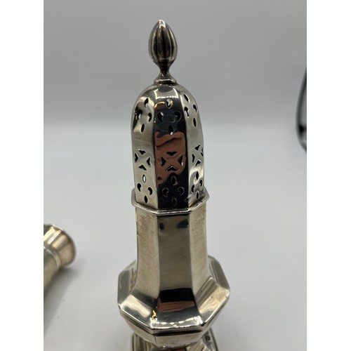 83 - A collection of sterling silver items , a mustard and pepper grinder by Goldsmiths silversmiths Comp... 