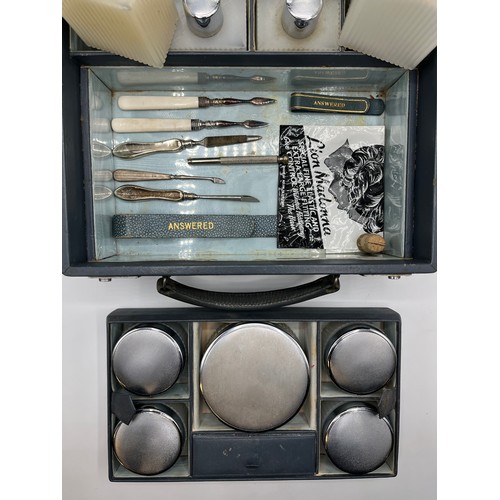 84 - Asprey London . A mid 20th century faux leather ladies dressing table travel case. Complete with ful... 