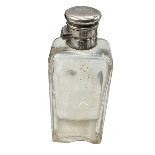 96 - A leather hunting case containing a silver topped flask and white metal sandwich tin together with a... 