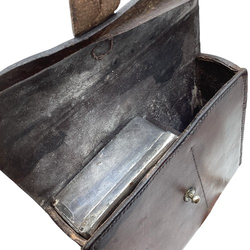 96 - A leather hunting case containing a silver topped flask and white metal sandwich tin together with a... 