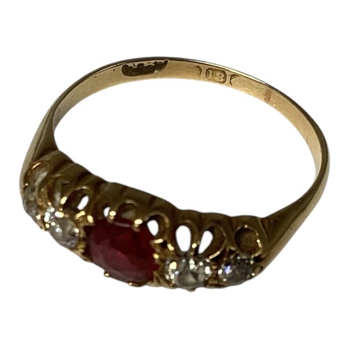 24 - An 18ct gold ruby and diamond ring. central round free cut ruby with old cut diamond accents. Size M... 