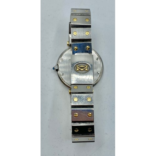 128 - Cartier. A Santos de Cartier yellow and white metal ladies wristwatch. 25mm case with white face and... 