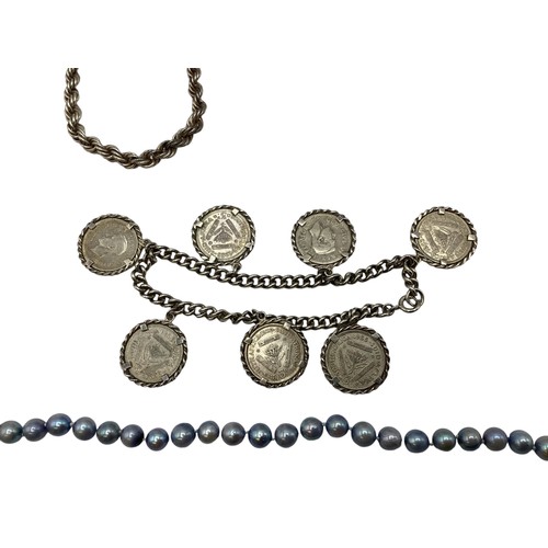 109 - A collection of silver and white metal items to include a sterling silver coin set bracelet, a white... 