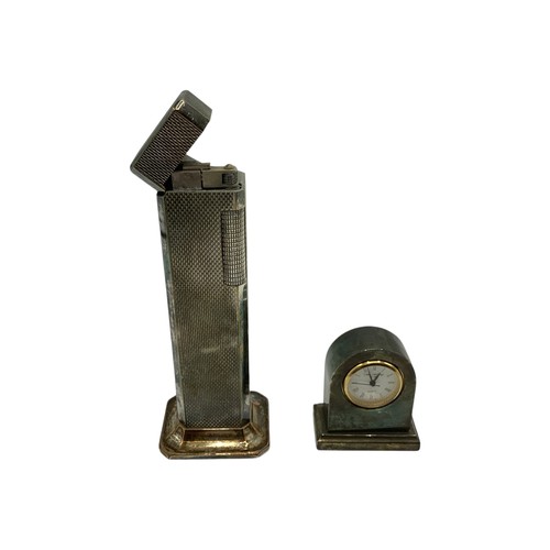 105 - A 925 silver mounted cigar cutter together with a white metal Dunhill Tallboy table lighter A Gucci ... 