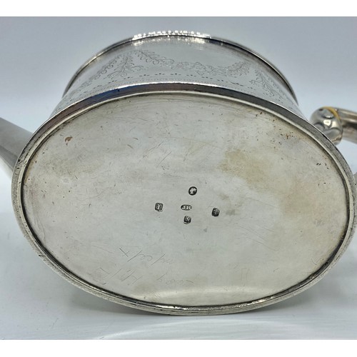 117 - A sterling silver teapot with chased decoration by James Reid & Co, Glasgow, 1868. Gross 420g.