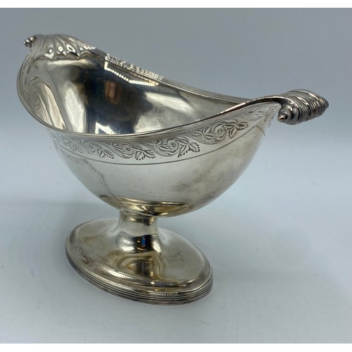 118 - A sterling silver boat shaped bowl with scroll finials on stepped foot with chased decoration by Hen... 