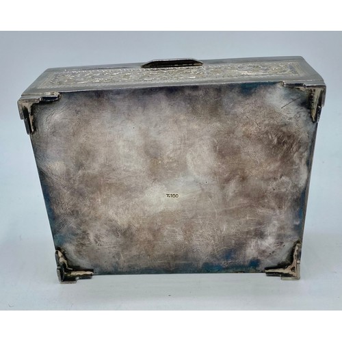 110 - An Anglo Indian white metal box marked T100 to base with floral repousse decoration and cedar lining... 