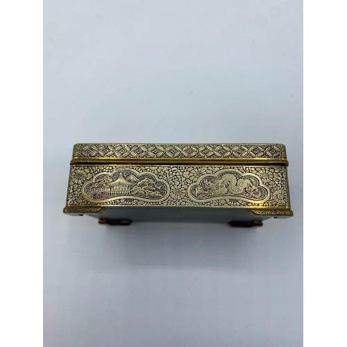 111 - A yellow metal Japanese Damascene style box. Dragon and Phoenix to lid with signature to base. 8cm x... 