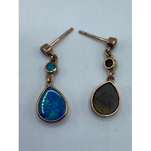 150 - A pair of 18ct gold ear rings together with a a pair of unmarked yellow metal and black opal doublet... 