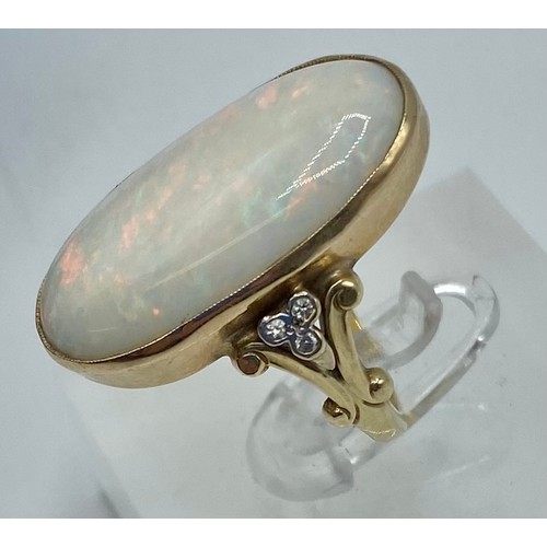 133 - A 9 ct gold Opal and Diamond dress ring oval cabochon cut opal 25 mm x 14mm with single cut diamond ... 