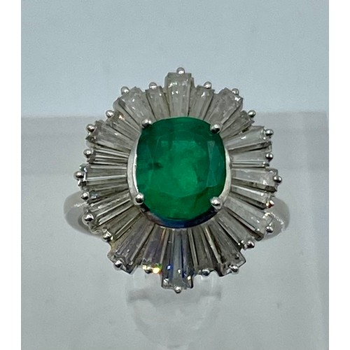 135 - Unmarked white metal Emerald and Diamond halo ring central oval free cut Emerald 8mm x 5mm approx wi... 