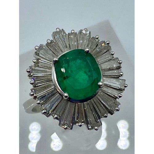 135 - Unmarked white metal Emerald and Diamond halo ring central oval free cut Emerald 8mm x 5mm approx wi... 