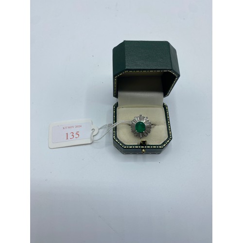 135 - Unmarked white metal Emerald and Diamond halo ring central oval free cut Emerald 8mm x 5mm approx wi... 