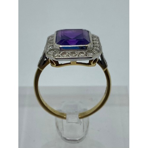 146 - An 18ct yellow and white gold amethyst and diamond dress ring. Emerald cut amethyst with a surround ... 