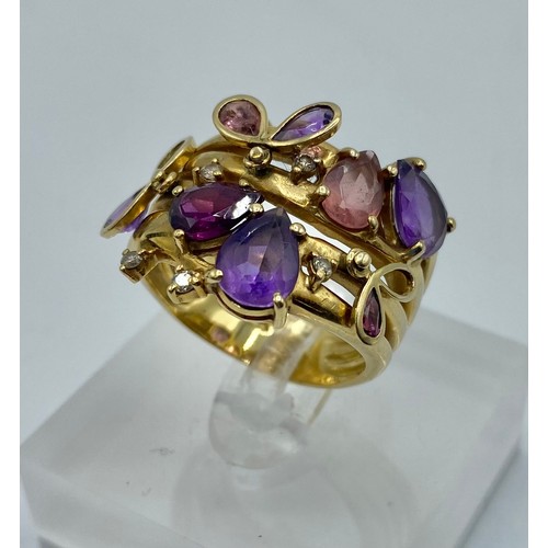 140 - An 18 ct gold Amethyst and diamond dress ring set with four free cut amethysts with 3 amethyst set t... 