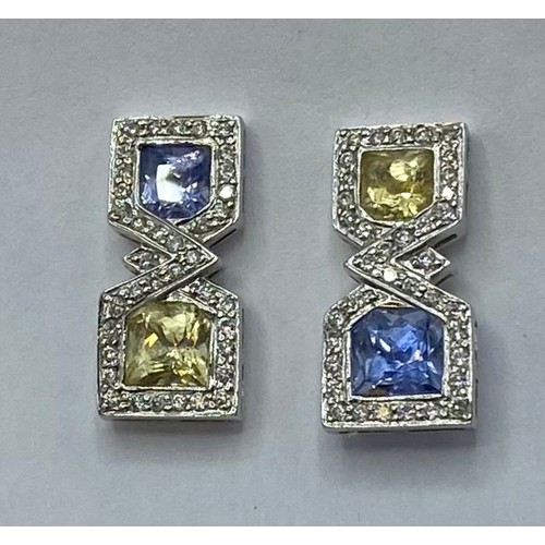 148 - A pair of 18ct white gold sapphire,  fancy yellow sapphire and diamond drop earrings/ Each set with ... 