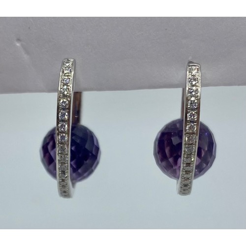 149 - A pair of 18ct white gold amethyst and diamond ear rings. 6.8g.