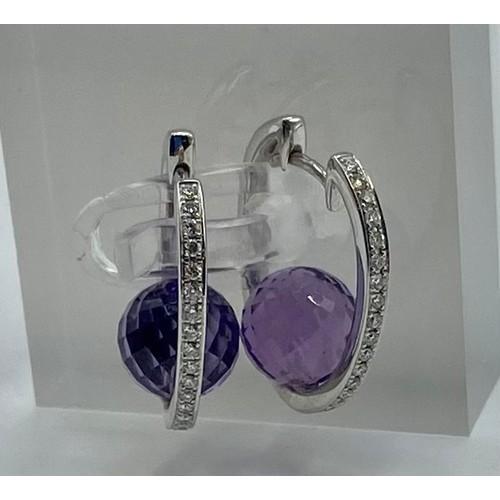 149 - A pair of 18ct white gold amethyst and diamond ear rings. 6.8g.