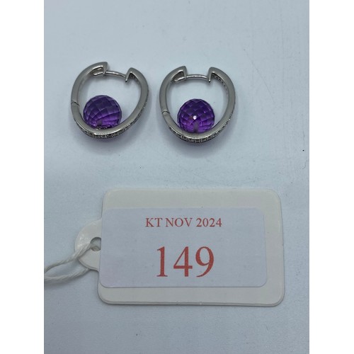 149 - A pair of 18ct white gold amethyst and diamond ear rings. 6.8g.