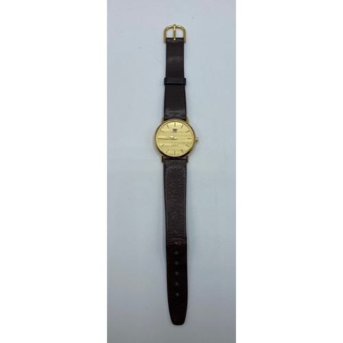 151 - An unmarked yellow metal gentleman's wrist watch Taj Group with quartz movement on black leather str... 