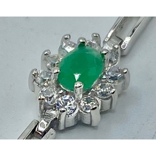 153 - A silver and emerald bracelet set with four oval free cut emeralds/ 7.7g. 18cm