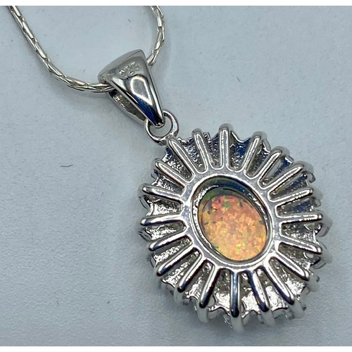 156 - A 925 silver and  opal set reconstituted pendant with 925 silver chain.