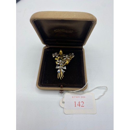 142 - An 18 ct yellow and white gold floral spray broach set with 6 single cut diamonds, 11.4 g