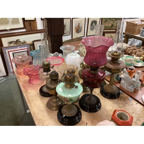 189 - A quantity of C20th oil lamps, and modern glass shades, etc, see all images. All sold as seen and as... 