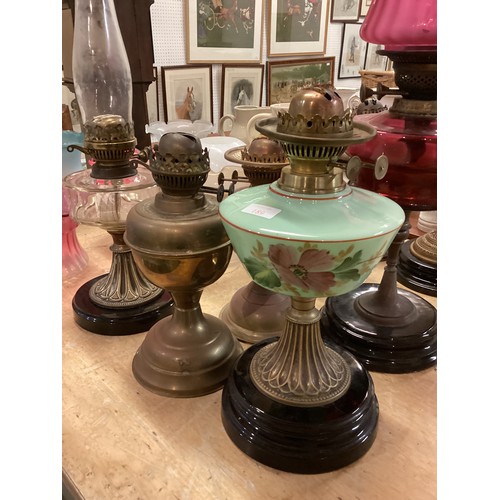 189 - A quantity of C20th oil lamps, and modern glass shades, etc, see all images. All sold as seen and as... 