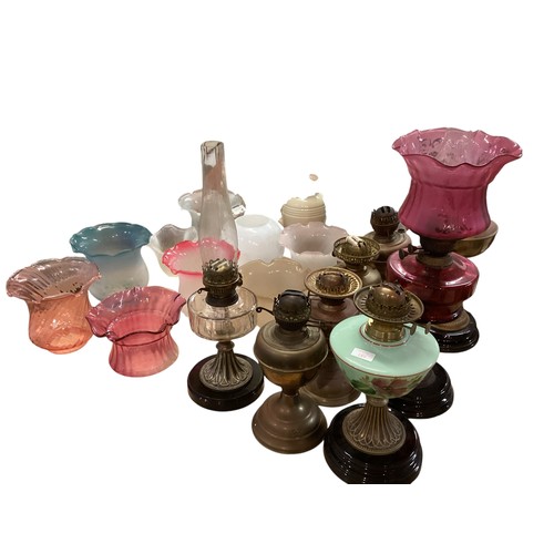 189 - A quantity of C20th oil lamps, and modern glass shades, etc, see all images. All sold as seen and as... 