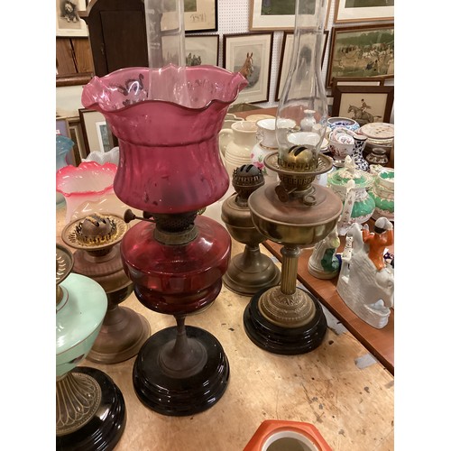 189 - A quantity of C20th oil lamps, and modern glass shades, etc, see all images. All sold as seen and as... 