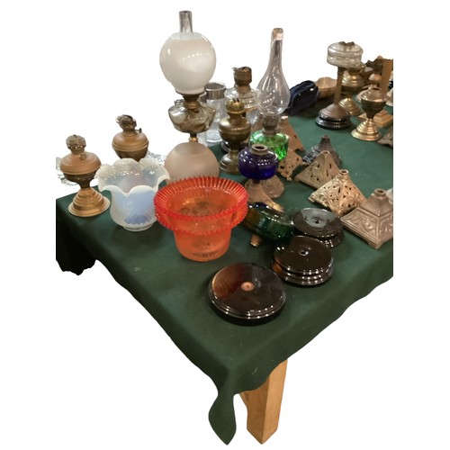 187 - A quantity of early C20th and later oil lamps, stands, resevoirs, modern glass shades, etc, see all ... 