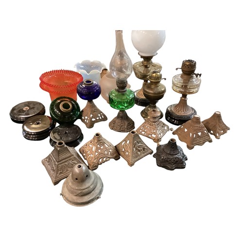 187 - A quantity of early C20th and later oil lamps, stands, resevoirs, modern glass shades, etc, see all ... 