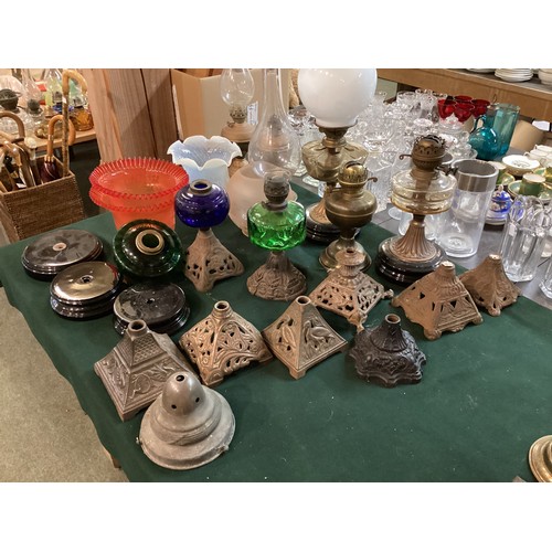 187 - A quantity of early C20th and later oil lamps, stands, resevoirs, modern glass shades, etc, see all ... 