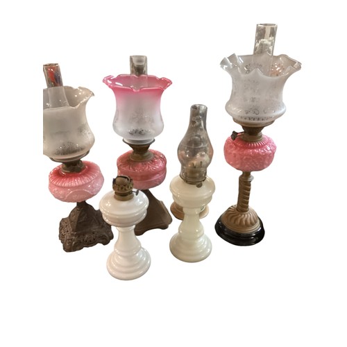 186 - A quantity of early C20th and later oil lamps, stands, resevoirs etc, see all images. All sold as se... 