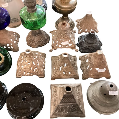 187 - A quantity of early C20th and later oil lamps, stands, resevoirs, modern glass shades, etc, see all ... 