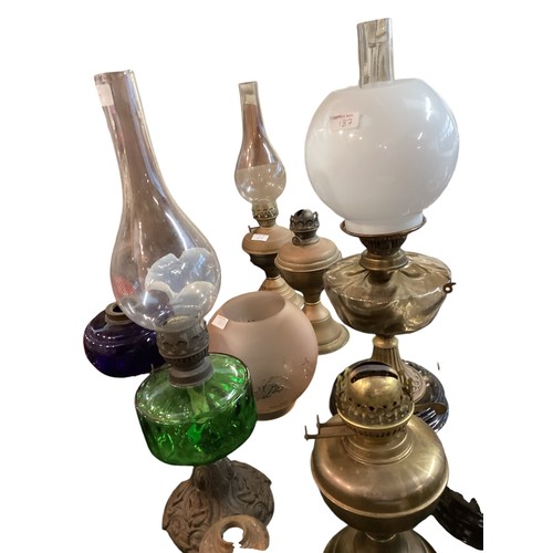 187 - A quantity of early C20th and later oil lamps, stands, resevoirs, modern glass shades, etc, see all ... 