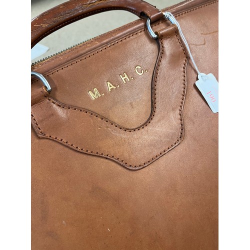 190 - A leather case with zip and straps, initalled M A H C, and makers label to inside, Norris, made in E... 