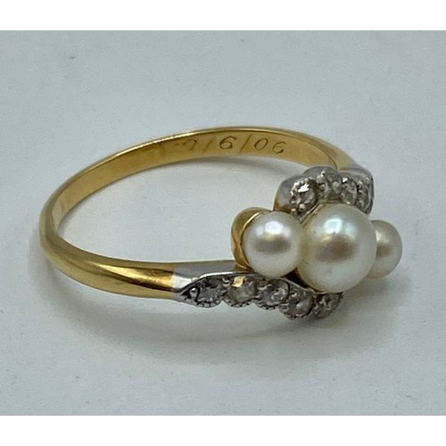 171 - An unmarked yellow and white metal pearl and diamond ring. Three graduating button pearls with flute... 