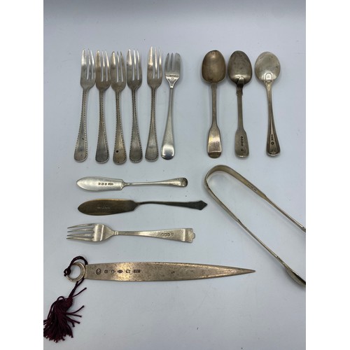 165 - A quantity of sterling silver items to include Armada dishes, , match box holders,, a sporting troph... 