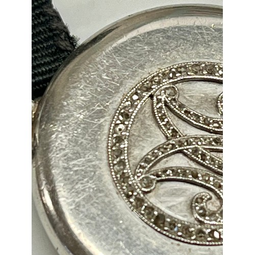 176 - Cartier. A Cartier platinum and diamond set fob watch. Circular engine turned dial with Arabic  mark... 