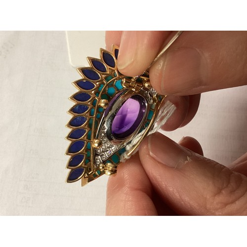 1 - Cartier. A Cartier eye brooch, enamel turquoise amethyst and diamond to a yellow and white metal mou... 