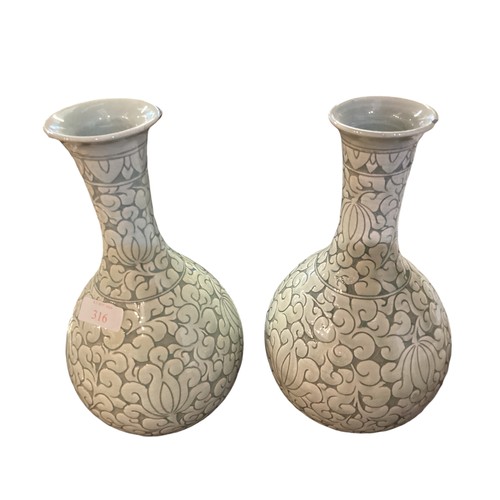 223 - A pair of decorative, Chinese Celadon style bottle neck vases  29cm High, chip to rim